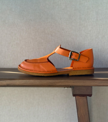 closed-toe sandals hand...