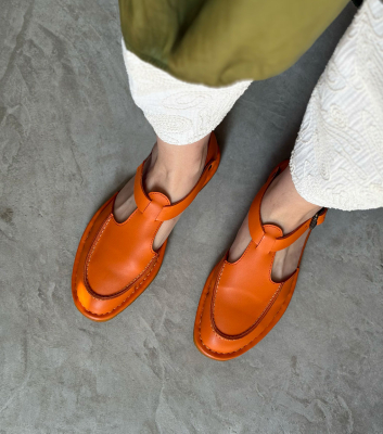 closed-toe sandals hand...