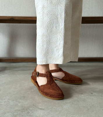 closed-toe sandals hand...